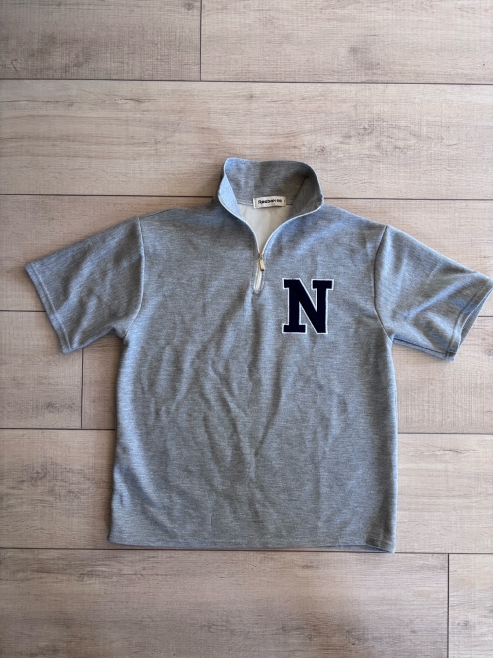 VTG Reebok Quarter-Zip Short Sleeve Sweatshirt with Navy 'N' Patch Size L